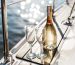 Champagne bottle with glasses on a boat