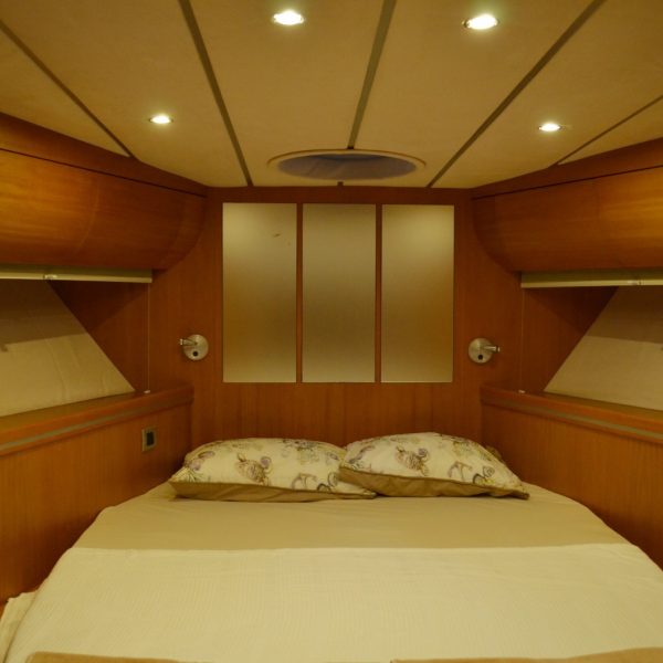 Bedroom with a bed on a yacht