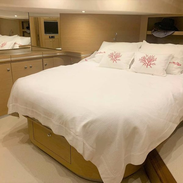 Bedroom with a bed on a yacht