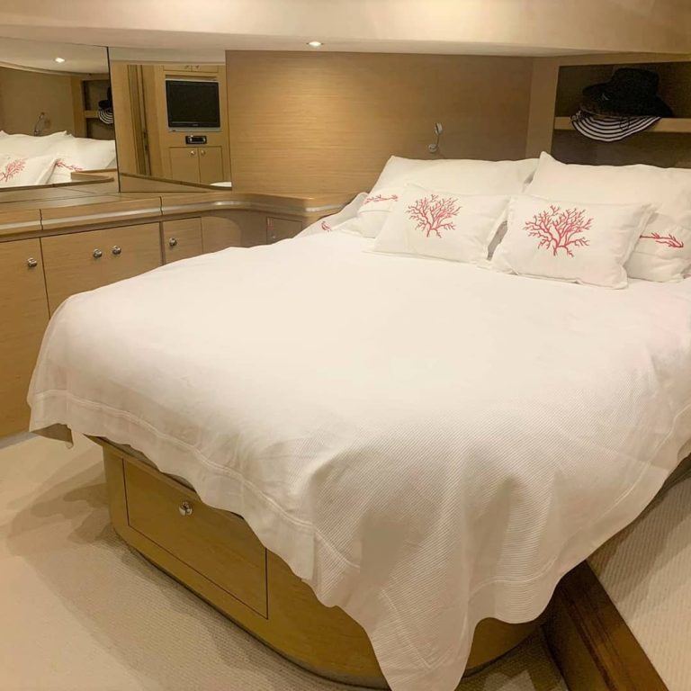 Bedroom with a bed on a yacht