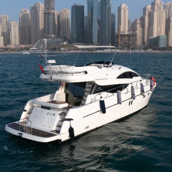 Side view of a white yacht sailing in the sea