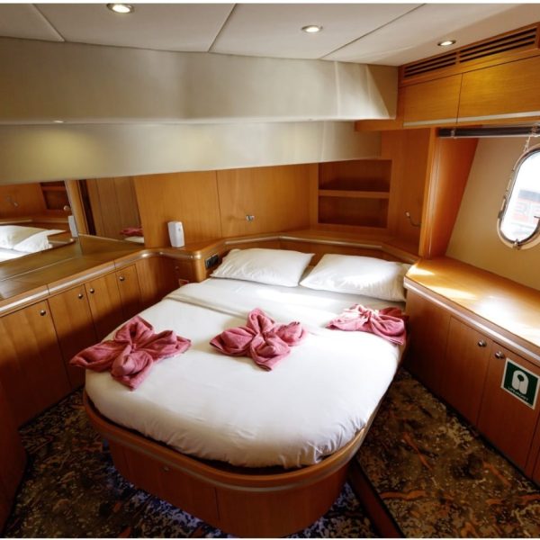 Bedroom with a bed on a yacht